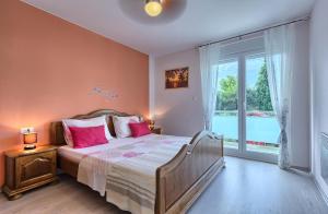 Posteľ alebo postele v izbe v ubytovaní Villa Anadi