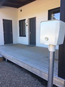 a security light on a porch of a house at Paljakka Villas in Kotila