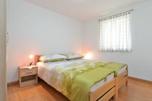 Posteľ alebo postele v izbe v ubytovaní Apartments Josip 1713