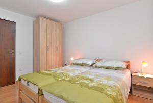 Posteľ alebo postele v izbe v ubytovaní Apartments Josip 1713