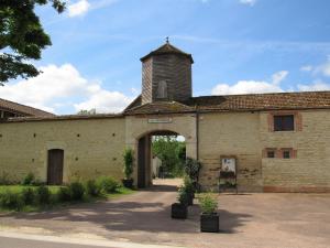 an old brick building with a tower on top of it at Domaine le Colombier in Dienville +8 photos