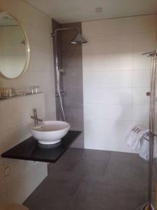 a bathroom with a sink and a shower at Chalets in der Forststraße in Miltach