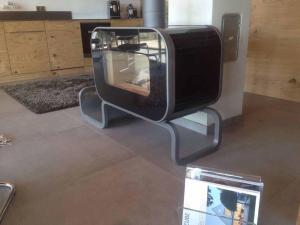 a television sitting on a stand in a living room at Chalets in der Forststraße in Miltach
