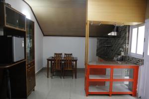 Virtuvė arba virtuvėlė apgyvendinimo įstaigoje Vamoose Mandarin Village Resort