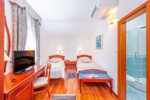 Postel nebo postele na pokoji v ubytování Hotel Ostrea