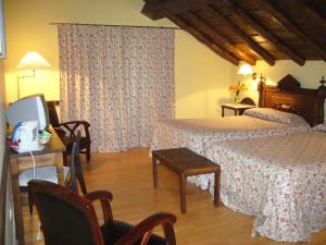 מיטה או מיטות בחדר ב-Hotel Rural Casa Roja