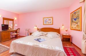 Postel nebo postele na pokoji v ubytování Hotel Ostrea
