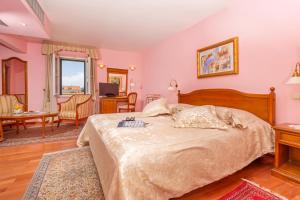 Postel nebo postele na pokoji v ubytování Hotel Ostrea
