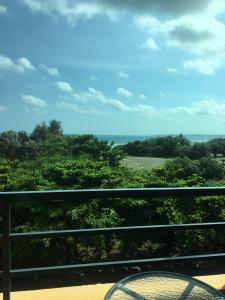 a view of the ocean from a balcony at Harmony Ocean Hotel in Kenting