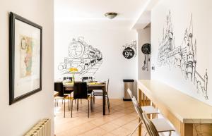 a dining room with a table and chairs at 4BR 3BATH BALCONY central Harry Potter penthouse in Prague