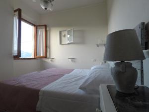 Katil atau katil-katil dalam bilik di Casa della nonna Filò