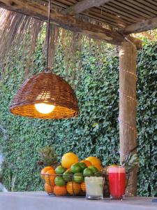 a bunch of fruit on a table in front of a wall at Atlántico Boutique Hotel in Punta del Este