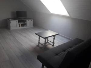 TV a/nebo společenská místnost v ubytování Chambre d'hôtes Comme une évidence Clairvaux-les-lacs