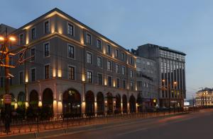 a large building on a city street at night at 10 Karakoy Istanbul in Istanbul
