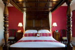 A bed or beds in a room at The Angel Inn, Boutique B&B and Tea Rooms 