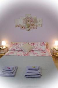 מיטה או מיטות בחדר ב-Dependance Miluna