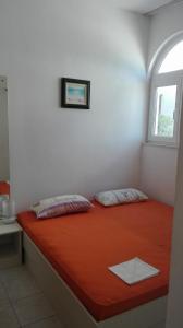 Ліжко або ліжка в номері Apartmani Erceg