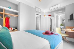 A bed or beds in a room at La Piazzetta Guest House
