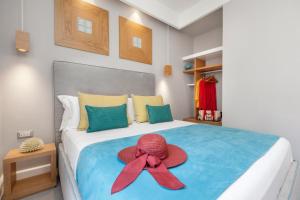 A bed or beds in a room at La Piazzetta Guest House