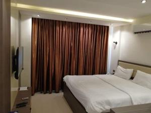 Letto o letti in una camera di Seven Days Hotel