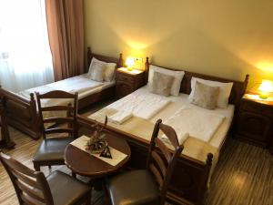 Postel nebo postele na pokoji v ubytování Mosoly Apartman