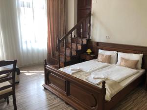 Postel nebo postele na pokoji v ubytování Mosoly Apartman