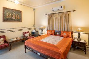 Postel nebo postele na pokoji v ubytování Hotel Rajasthan palace - A Boutique Heritage Hotel in Jaipur