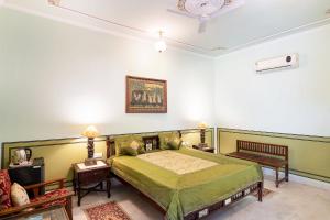 Postel nebo postele na pokoji v ubytování Hotel Rajasthan palace - A Boutique Heritage Hotel in Jaipur