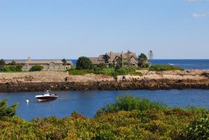 a small boat in a body of water at The Lodge at Turbat's Creek in Kennebunkport