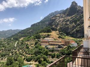 a view of the mountains from a balcony at Mirador Castillo La Iruela in Cazorla