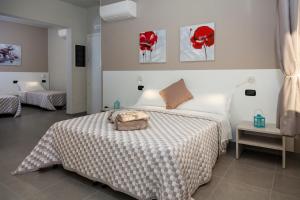 Posteľ alebo postele v izbe v ubytovaní Riviera HUB