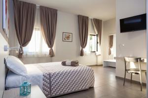Posteľ alebo postele v izbe v ubytovaní Riviera HUB