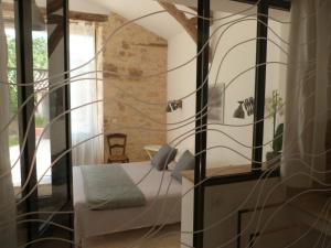 Giường trong phòng chung tại Chambres d'hotes Le Plassalou
