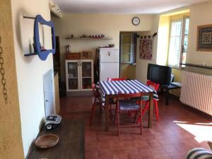 a kitchen and dining room with a table and chairs at Cinqueterre - Terrace and beautiful view in Levanto