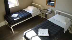Postel nebo postele na pokoji v ubytování Central Private Hotel