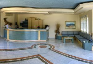 a lobby with a bar and a waiting room at Papadakis in Georgioupolis
