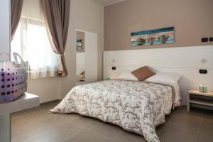 Posteľ alebo postele v izbe v ubytovaní Riviera HUB
