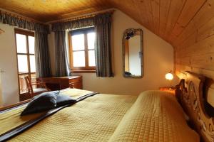 a bedroom with a large bed in a room at Haus Franz by ISA AGENTUR in Bad Kleinkirchheim