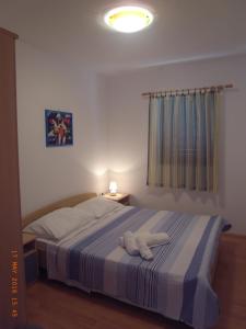 Posteľ alebo postele v izbe v ubytovaní Apartmani MW, Plavi apartman
