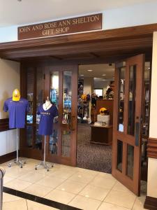 a store with two mannequins on display in a store at The Cook Hotel & Conference Center in Baton Rouge
