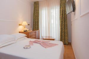 Postel nebo postele na pokoji v ubytování Oleandri Resort Paestum