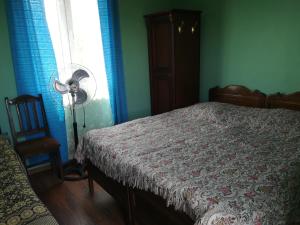 Voodi või voodid majutusasutuse Guest house of Givi toas
