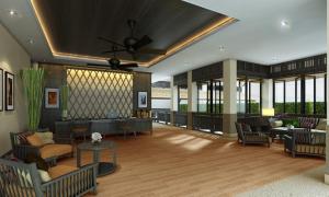 salon z kanapami, stołami i oknami w obiekcie Panya Resort Hotel w mieście Udon Thani