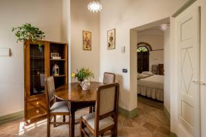 Postel nebo postele na pokoji v ubytování Agriturismo Podere La Rocca