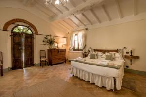 Postel nebo postele na pokoji v ubytování Agriturismo Podere La Rocca