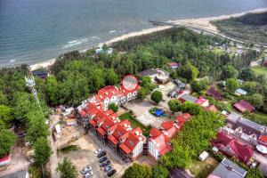an aerial view of a building next to a beach at Apartament Plaza in Rowy