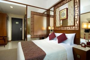 Postel nebo postele na pokoji v ubytování Lan Kwai Fong Hotel - Kau U Fong