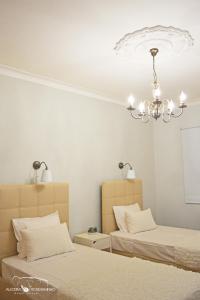 Uma cama ou camas num quarto em Alecrim Rosmaninho Guest House