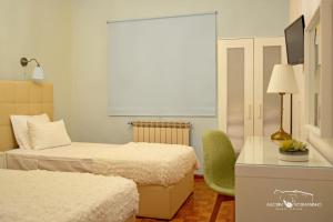 Uma cama ou camas num quarto em Alecrim Rosmaninho Guest House