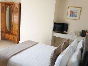 Cama o camas de una habitación en Alcuin Lodge Guest House